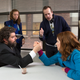 Carlock (middle), on set with Bobby Moynihan and Ellie Kemper